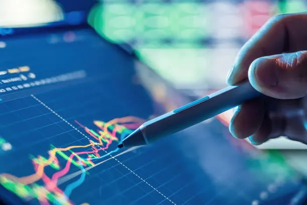 businessman-use-tablet-and-smart-phone-for-stock-market.webp